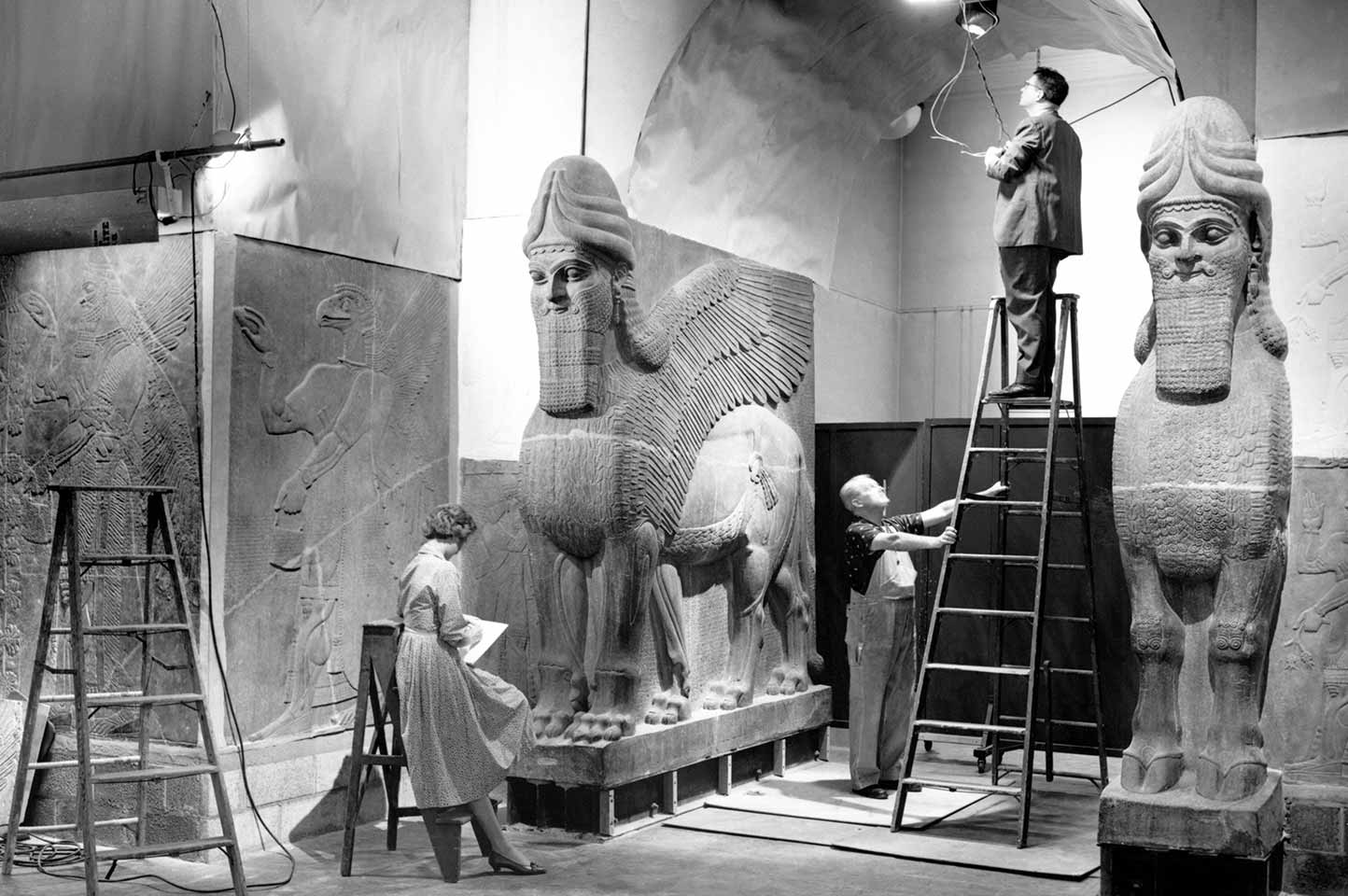 Archival image of installing Assyrian reliefs in the Ancient Near East wing